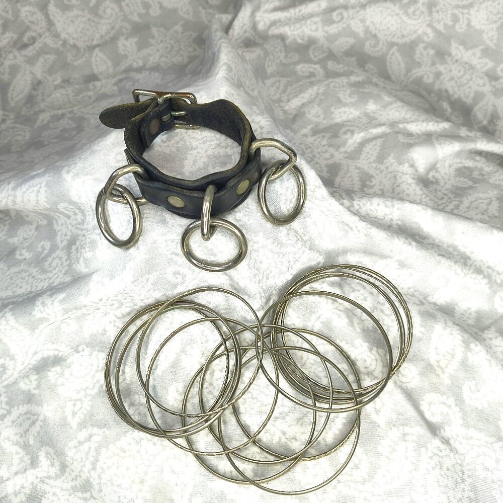 Vintage adjustable leather bondage 3 ring cuff with several metal bracelets